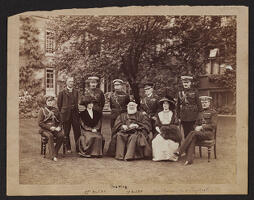 Photograph in the garden of the Master's Lodge with King George V and the Butlers